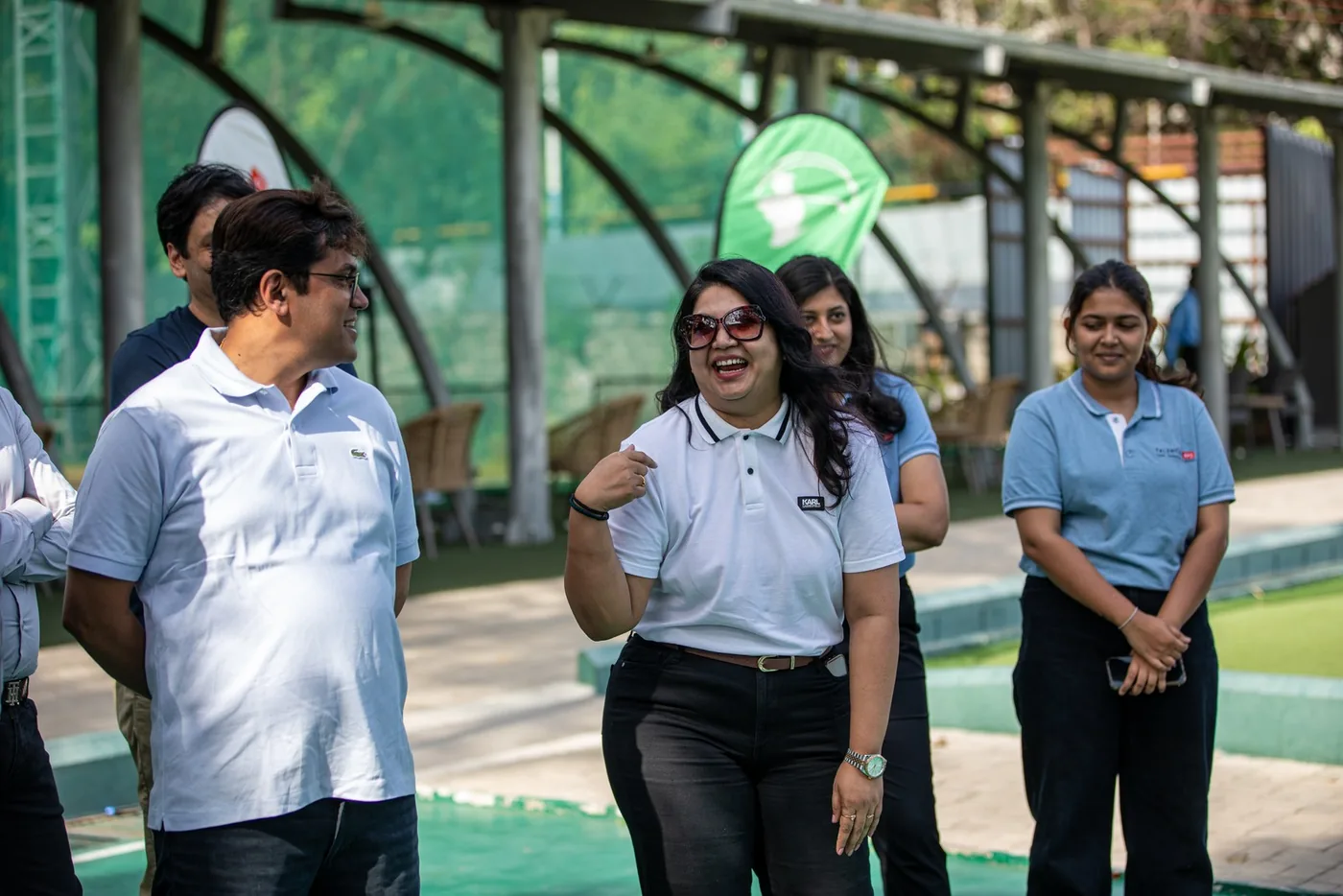 GCC leaders sharing a light moment beside the practice range